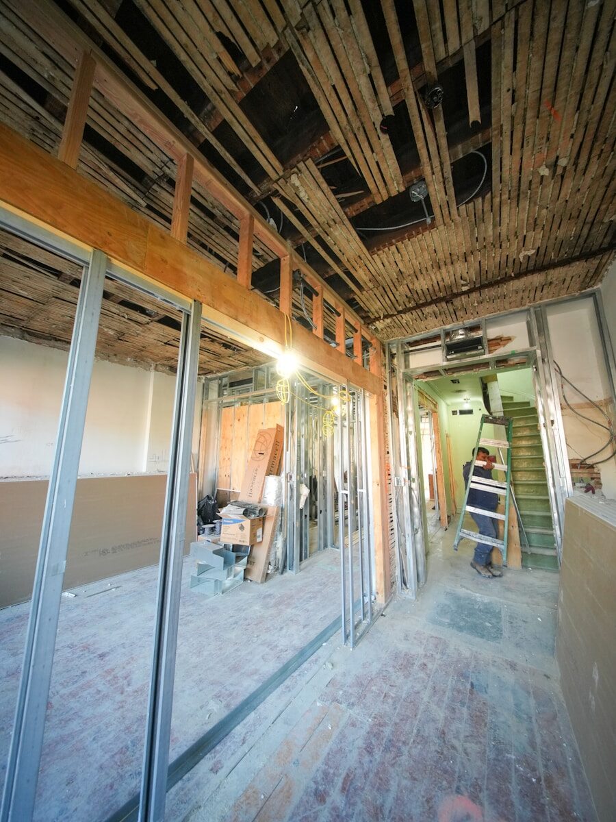 Interior of building under renovation with exposed framing.